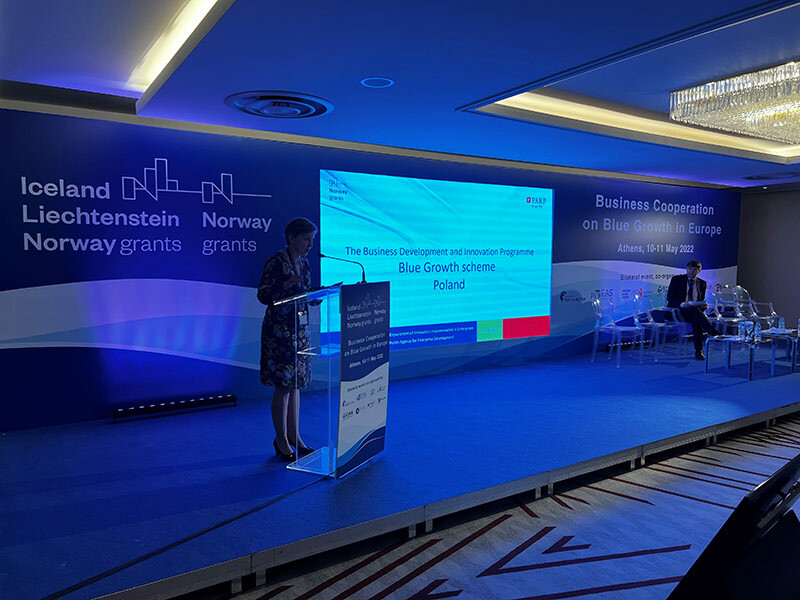 The photo shows Monika Karwat-Bury representing PARP (Innovation Implementation in Enterprises Department), who gave a presentation on the development of the Blue Growth scheme within the Business Development and Innovation Program in Poland